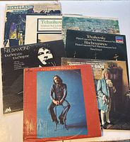Top-down image showing seven vinyl record covers including classical music and a Neil Diamond album.