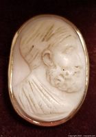 Front view of oval shell cameo depicting the bearded man in profile