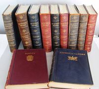 Group shot of all 11 volumes standing upright with two volumes laid flat (Surrey and London to the Nore)