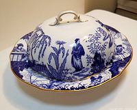 Assembled covered serving dish showing cobalt blue pattern and gold trim
