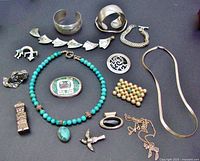 Overview of all 16 pieces arranged on black background