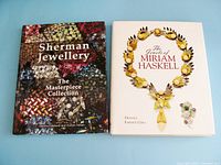 Both hardcover books - Sherman Jewellery The Masterpiece Collection and The Jewels of Miriam Haskell - shown flat on a surface.