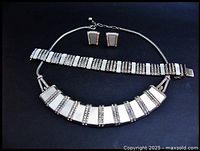 Full set displayed on black background, showing necklace, bracelet, and earrings with mother of pearl panels and rhinestone accents in silver tone metal.