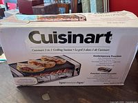 Front view of the original box showing the product name, image, and key features such as BPA free and three-in-one functionality.