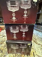 Photo of three stacked sets, each with the original box showing two glasses, indicating a total of 10 glasses in multiple boxes.