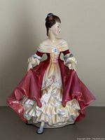 Front view of the Royal Doulton Southern Belle porcelain figurine showing the detailed dress and pose.