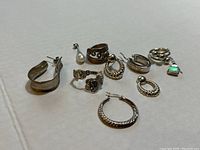 Overview of ten jewelry pieces on white background