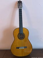Full front view of Yamaha G-255S classical guitar against white backdrop