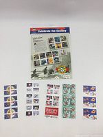 Front view of the Celebrate The Century 1940s stamp set with assorted Christmas stamps below, showing detailed visuals of stamps and packaging