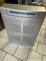 Front view showing Dayton air cleaner with vertical air intake grills and control panel