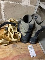 Pair of LL Bean boots viewed from back with included plastic cleats