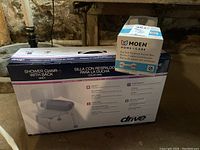 New boxed Drive shower chair with back and Moen suction balance assist bar in original packaging.