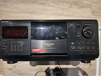 Sony 200-disc CD player front view showing buttons and disc loading area.