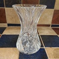 Birks crystal vase shown front-facing on a tiled surface.
