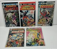 Front view of five Atlas Comics #1 issues in bags and boards.