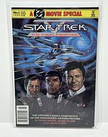 Front cover view of the comic featuring Star Trek characters and the ship Enterprise in space.