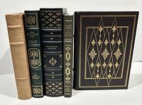 Five leather bound hardcover books from Franklin Library, standing upright showing spines with gold embossing.