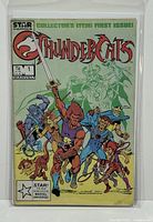 Front cover of the Thundercats #1 comic book in protective bag and board.