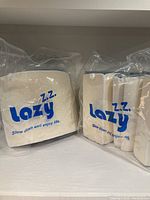 Six pieces of Lazy Z.Z. orthotic wedge pillows in original packaging with logo and slogan