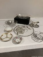 Full lot showing all 9 dishes including large glass plate, multiple bowls, and silver gravy boat