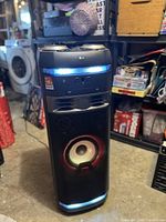 Front view of LG XBOOM OK75 speaker with LED lighting and mesh grille