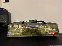 Photo of carrying bag packaging showing Ozark Trails 13 x 9 feet screen house tent with tent dimensions and features
