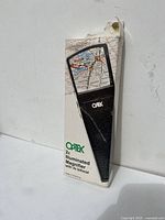 View of boxed Optex illuminated magnifier showing front of box and product image