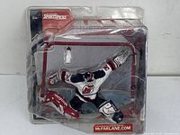 Vintage McFarlane Martin Brodeur hockey goalie figure in blister pack, showing front view of packaging and figure.