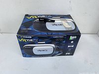 Box of Xtreme VR Vue FX Virtual Reality Viewer for mobile phones, showing front and top sides.