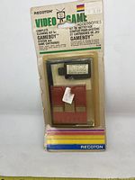 Front of original packaged cleaning kit for Game Boy system and cartridges by Recoton with visible price tags and wear on packaging