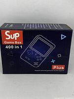 Box for Sup Game Box Plus showing 400 in 1 games and device illustration.