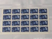 Full sheet of 20 Canadian 5 cent stamps from 1955 with space and satellite design, blue ink.