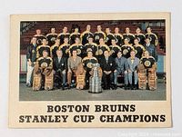 Front of the 1970-71 OPC Boston Bruins Stanley Cup Champions team card showing team photo and Stanley Cup trophy