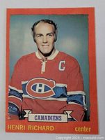 Front side of the vintage 1973-74 O-Pee-Chee Henri Richard hockey card showing player portrait and team logo.