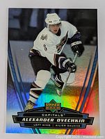 Holographic 2006 Upper Deck hockey card showing Alexander Ovechkin of the Capitals in action, with card details visible.