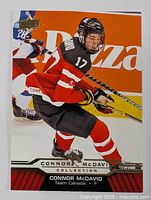 Front side of 2015 Upper Deck Connor McDavid Collection Team Canada hockey card showing player in action wearing jersey number 17.