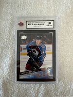 Front of the graded 2020-21 Upper Deck Bowen Byram hockey card showing player in Colorado Avalanche uniform and graded KSA 10 Gem Mint.