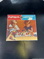 Box of Playskool Landscape Peg Set showing cover with two children playing with the set.