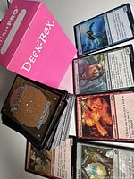 Pink Ultra Pro Deckbox with stack of Magic the Gathering cards showing front and back sides.