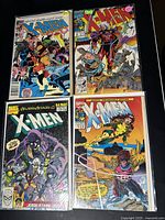 Photo of four 1980s X-Men comic books arranged in a 2x2 grid showing colorful covers with multiple characters.