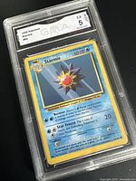 Photo of the 1999 Pokemon Starmie card graded EX 5 by GMA in protective slab.
