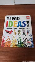 Front cover of The LEGO Ideas Book showing colorful LEGO bricks and models