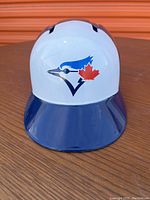 Front view of Toronto Blue Jays plastic replica batting helmet with logo.