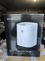 Front view of box showing the white smart trash can with black base, labeled 'Townew Smart Trash Can T Air Lite'.