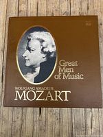 Brown outer box with portrait of Wolfgang Amadeus Mozart and the title 'Great Men of Music'.