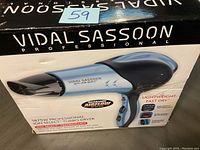 Photo of Vidal Sassoon hair dryer box showing the product image and features including increased airflow, ion select technology, and lightweight fast dry design.