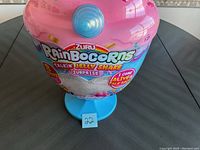 Front view of new Zuru Rainbocorns Talkin Jelly Shake Surprise toy container showing product branding and features.