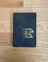 Cover of antique book titled 'Washington Irving' with embossed and gold foil design on dark cloth hardcover.