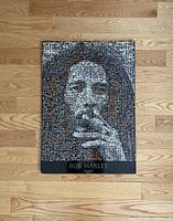 Photo of the plaque placed on a wooden floor showing full front view and wear details