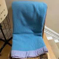 Blanket draped over chair showing overall size and color